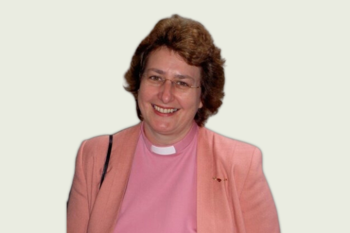 Delia Orme wearing a pink clerical shirt and jacket