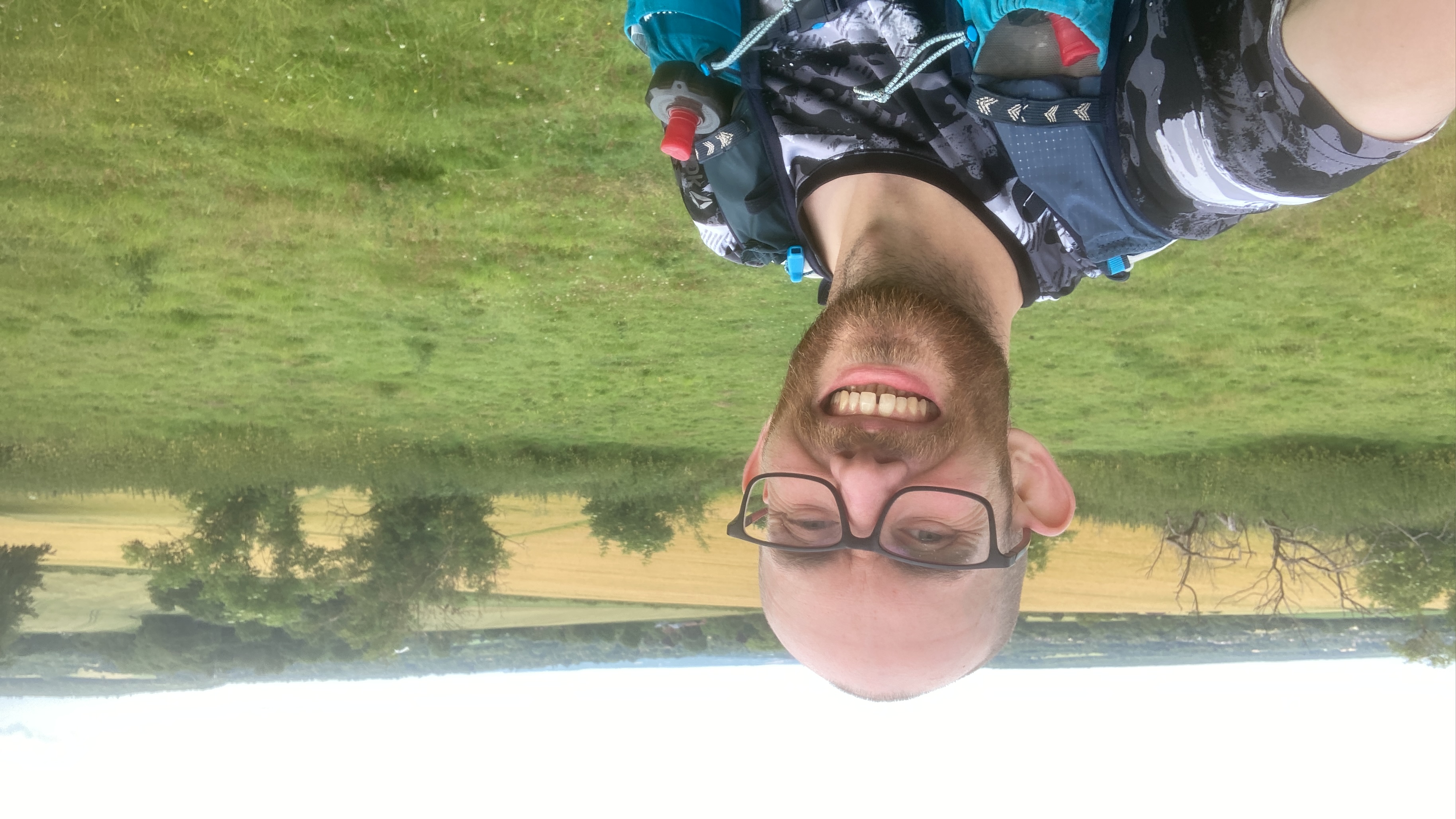 Revd Tim Westcott taking a scenic selfie of fields and hills on marathon run