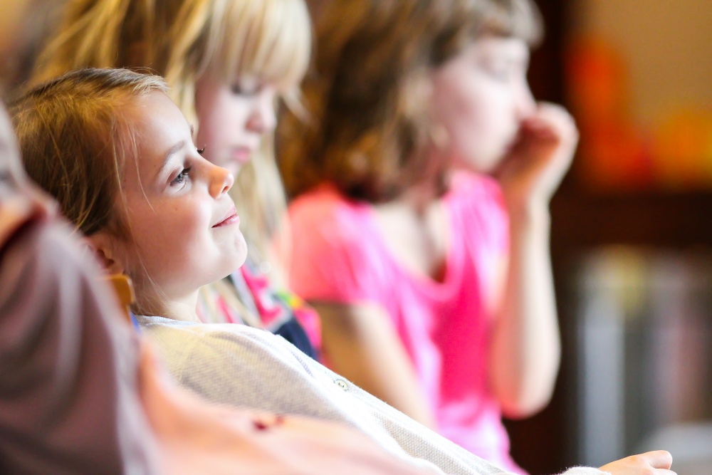 Young girls concentrating and smiling