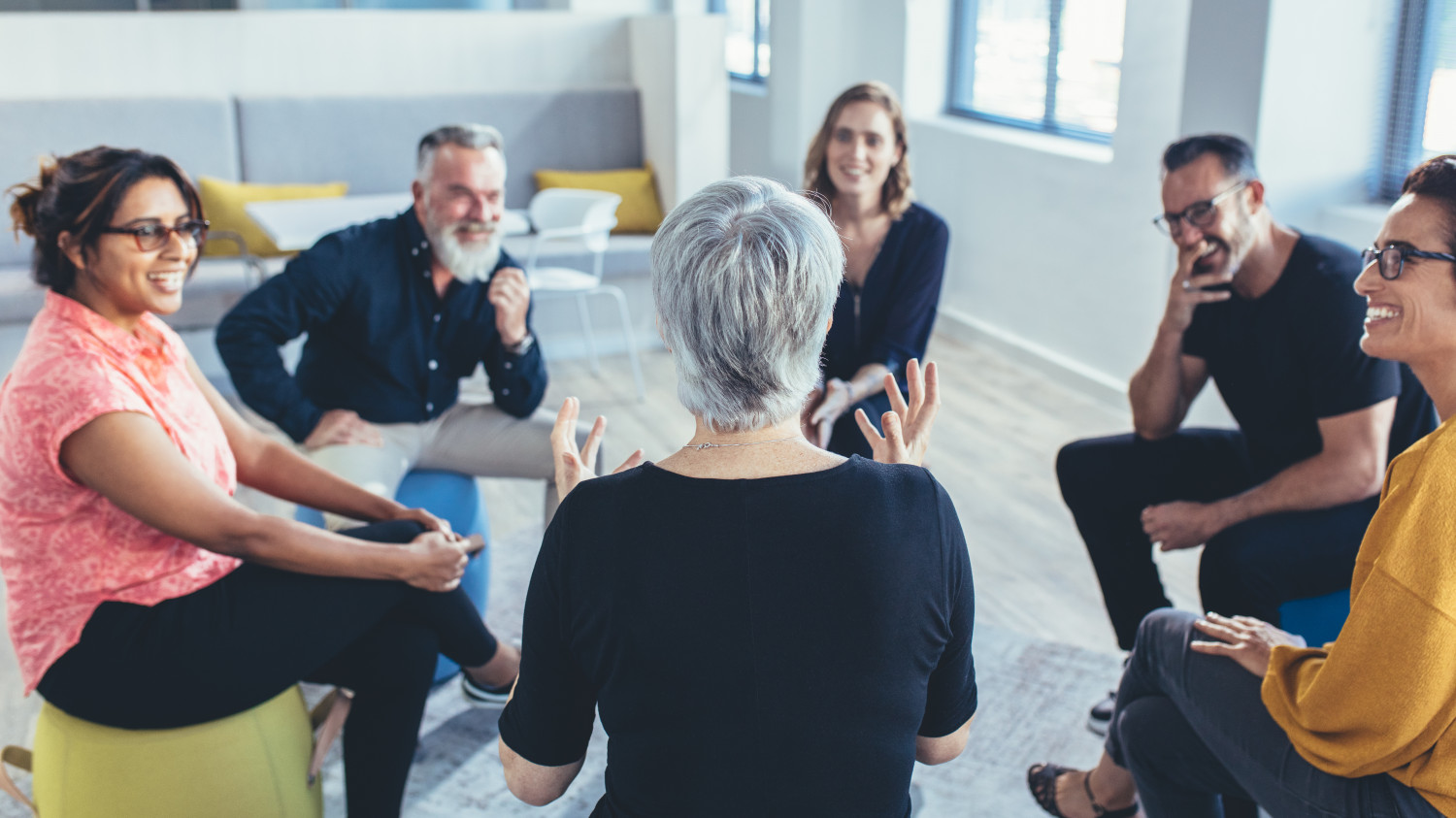 People sat facing one another in discussion