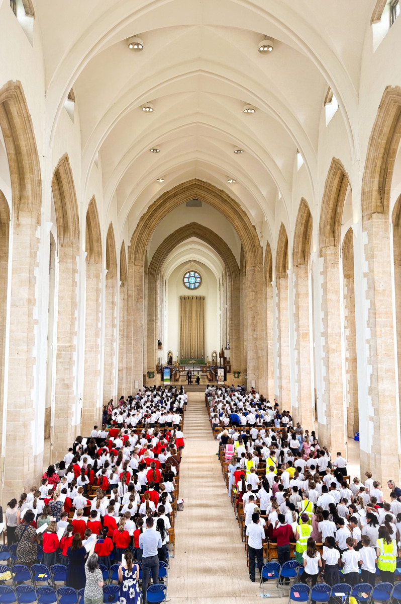 Hundred of school children and teachers stood worshipping in Guildford Cathedral
